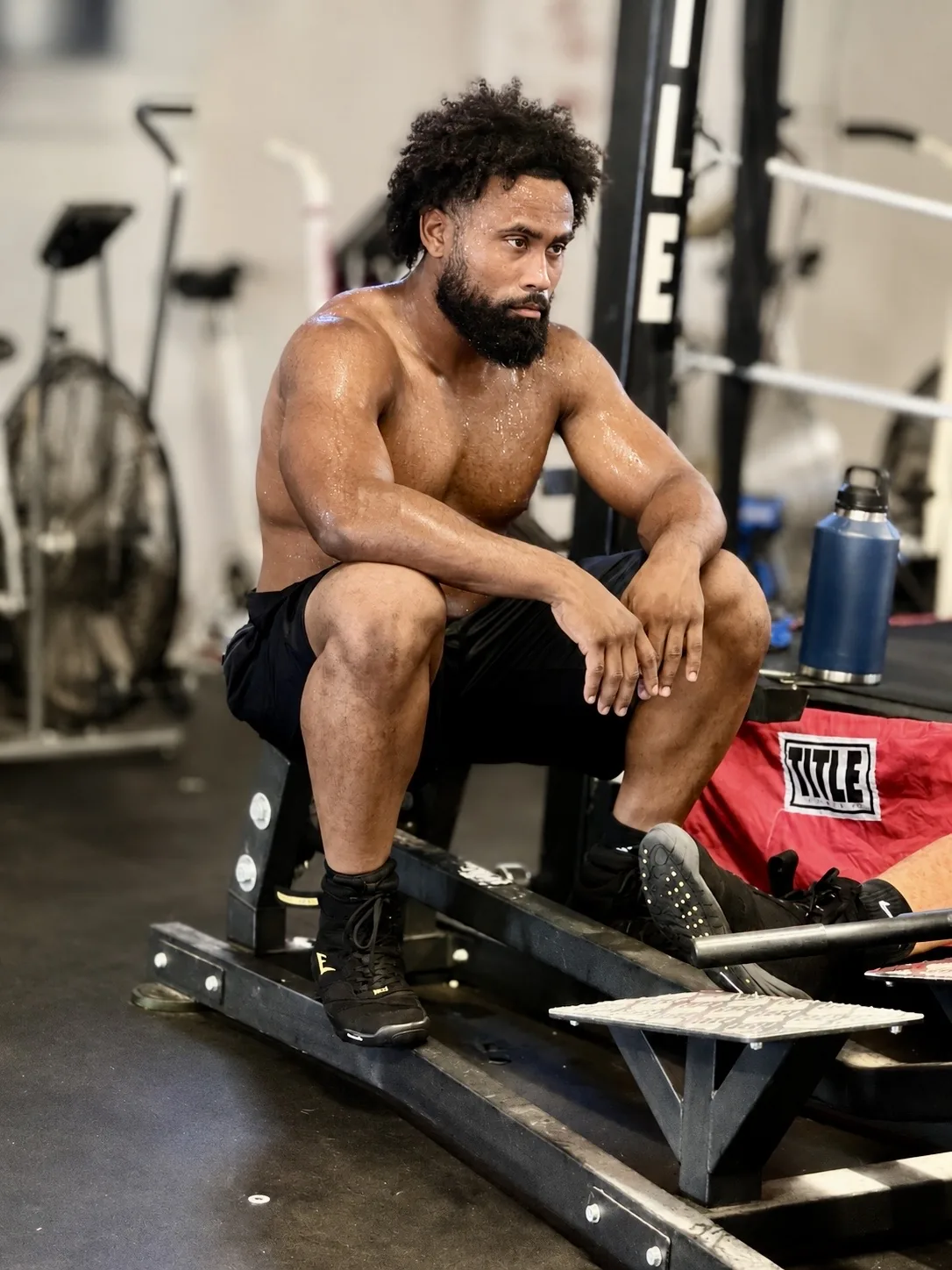 An athlete catching a breath between rounds