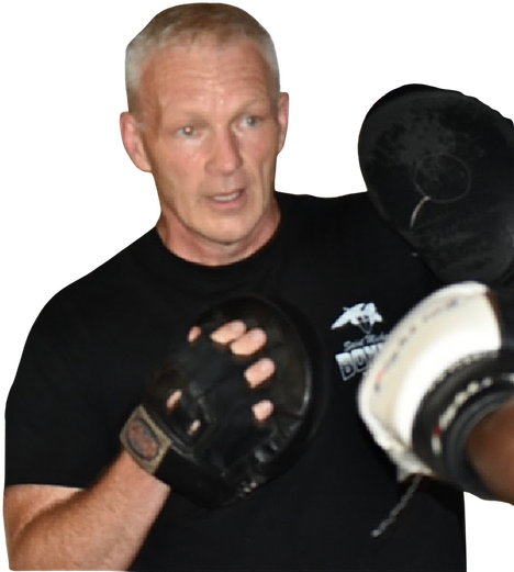 Coach Michael Englert, founder and head coach of Saint Michaels Boxing Club, working the focus mitts